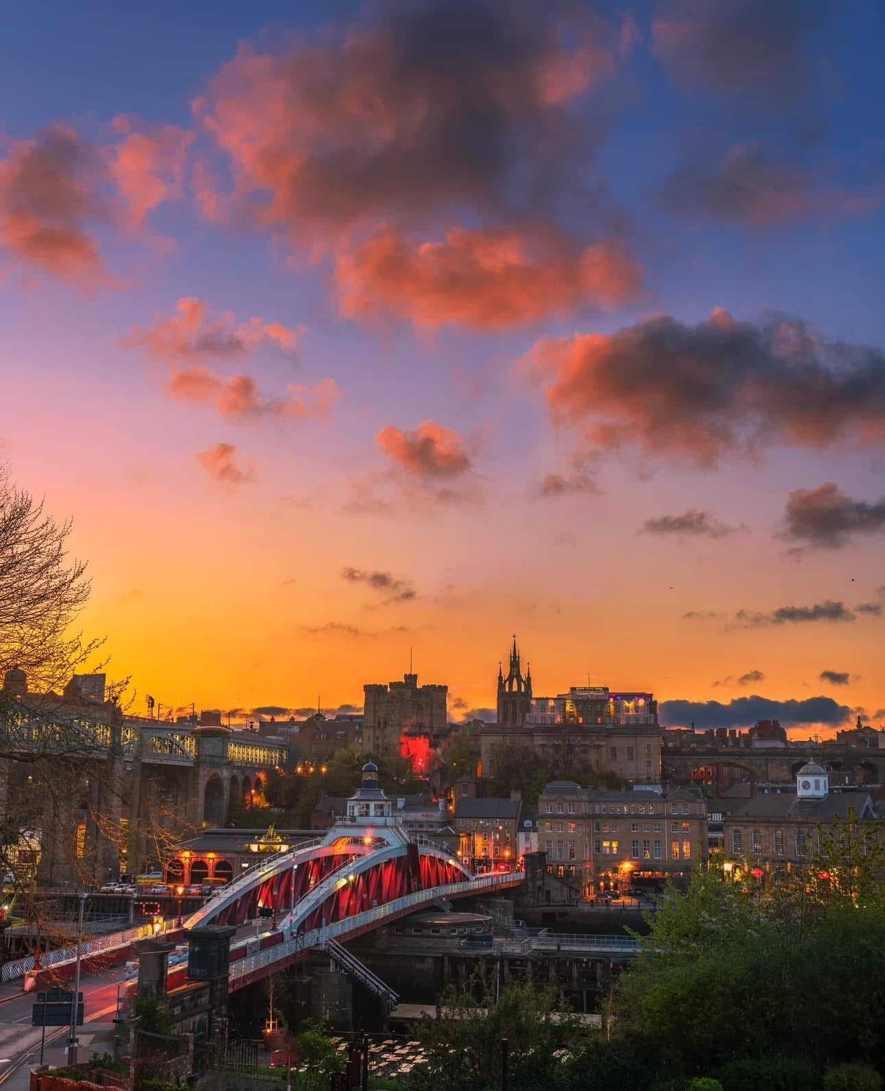 A view of Newcastle Swing Bridge with a vibrant sky.
