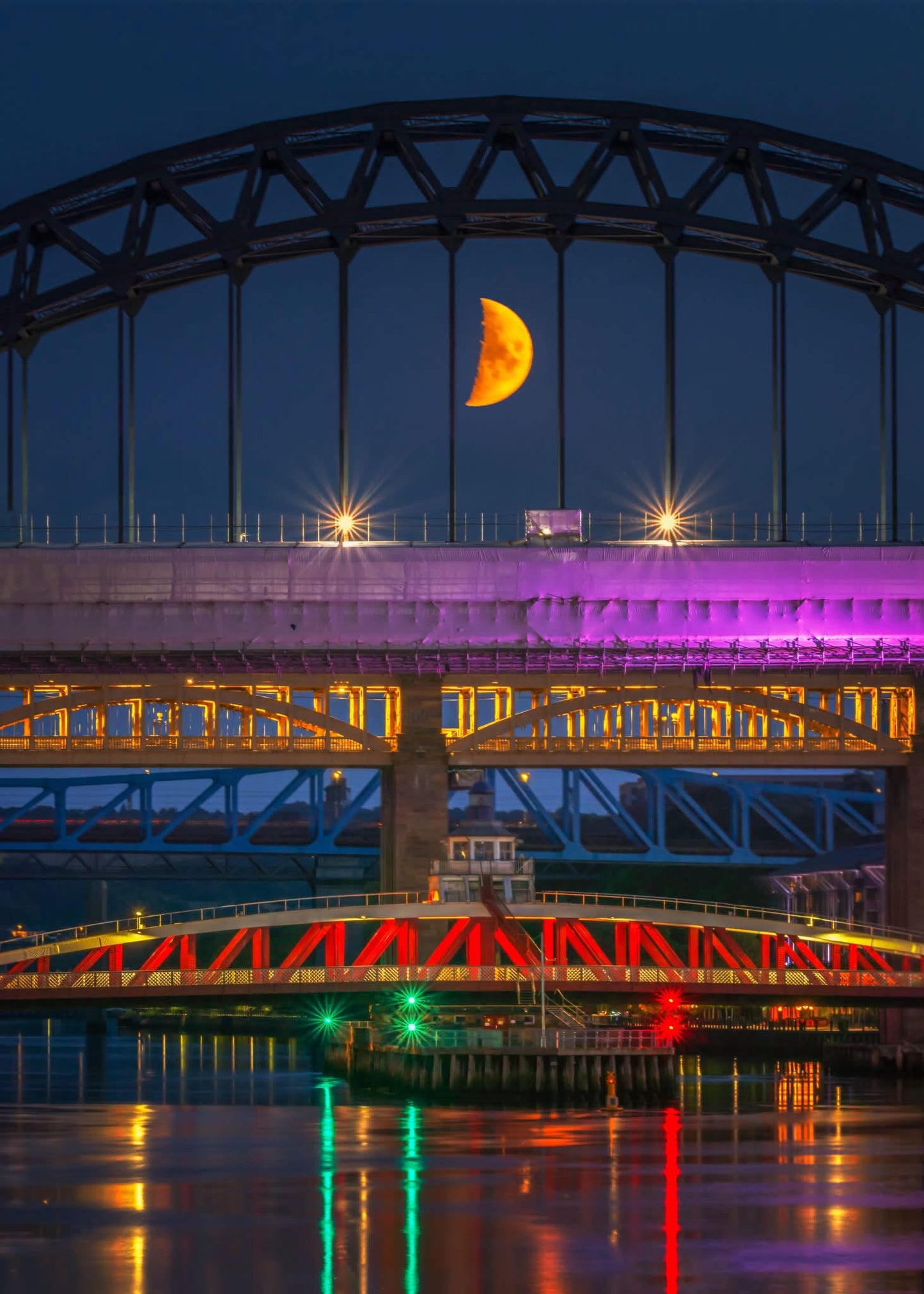The moon with the Newcastle Bridges.