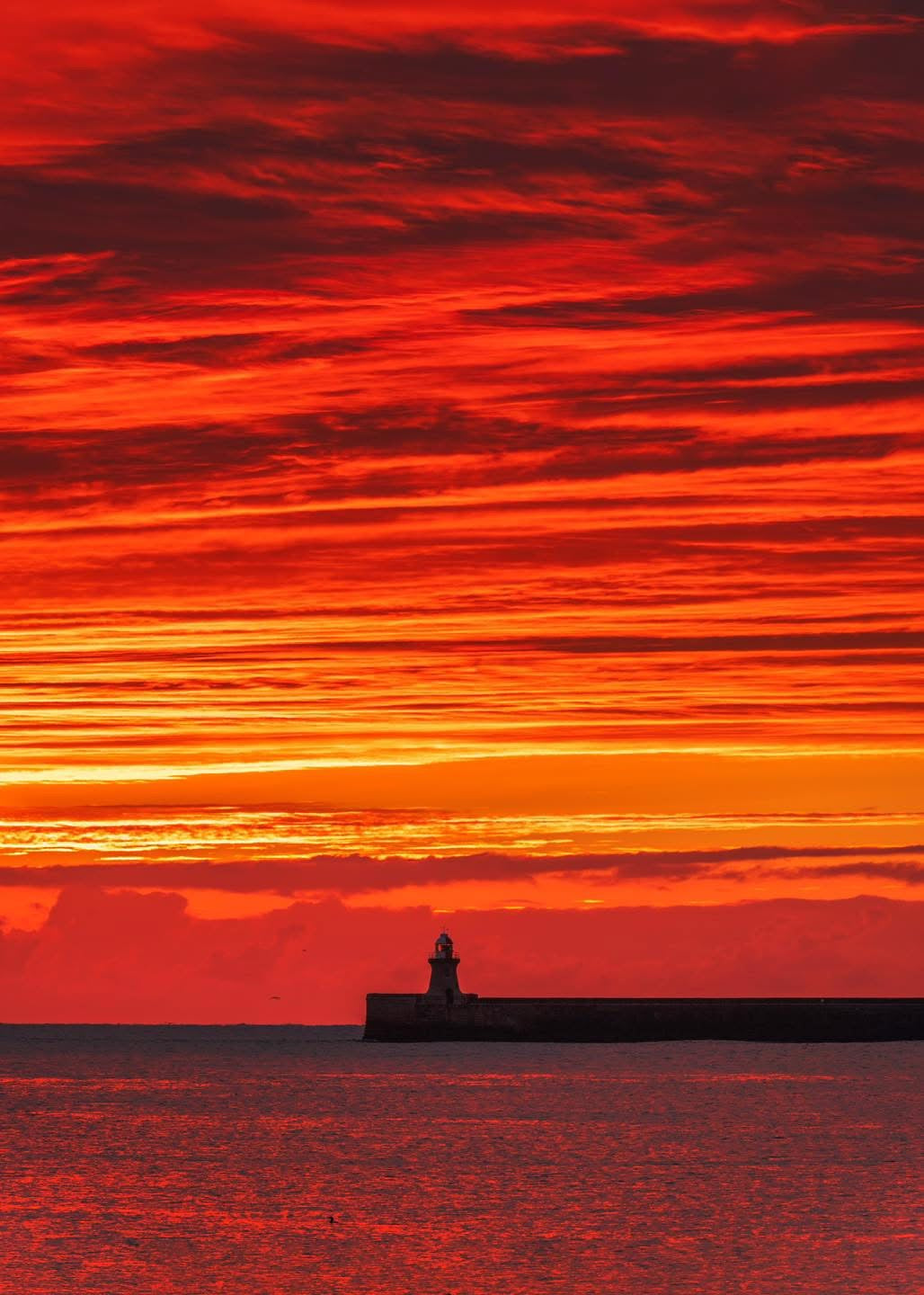 Epic sunrise sky over South Shields Lighthouse.