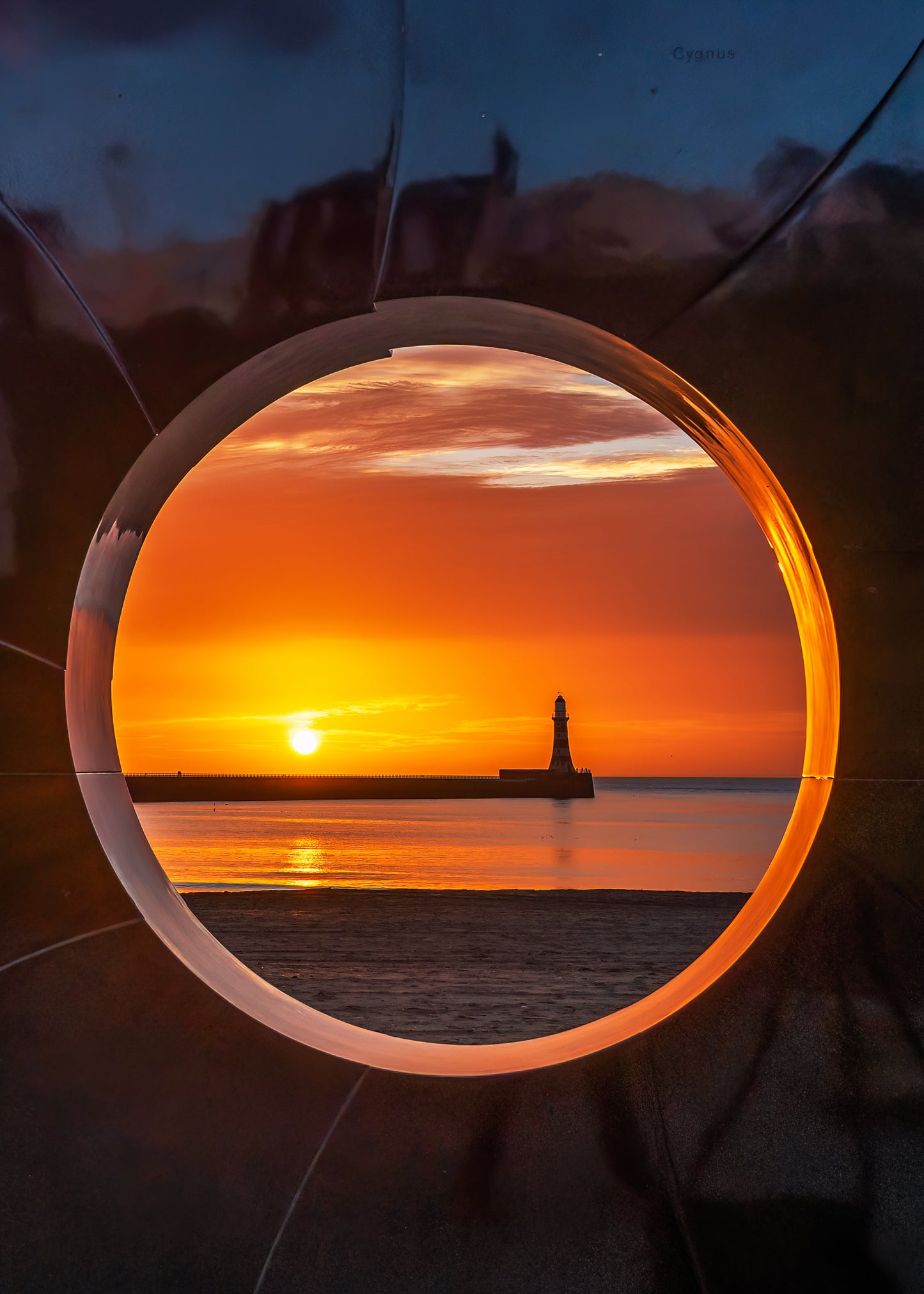 Roker Lighthouse through the porthole.