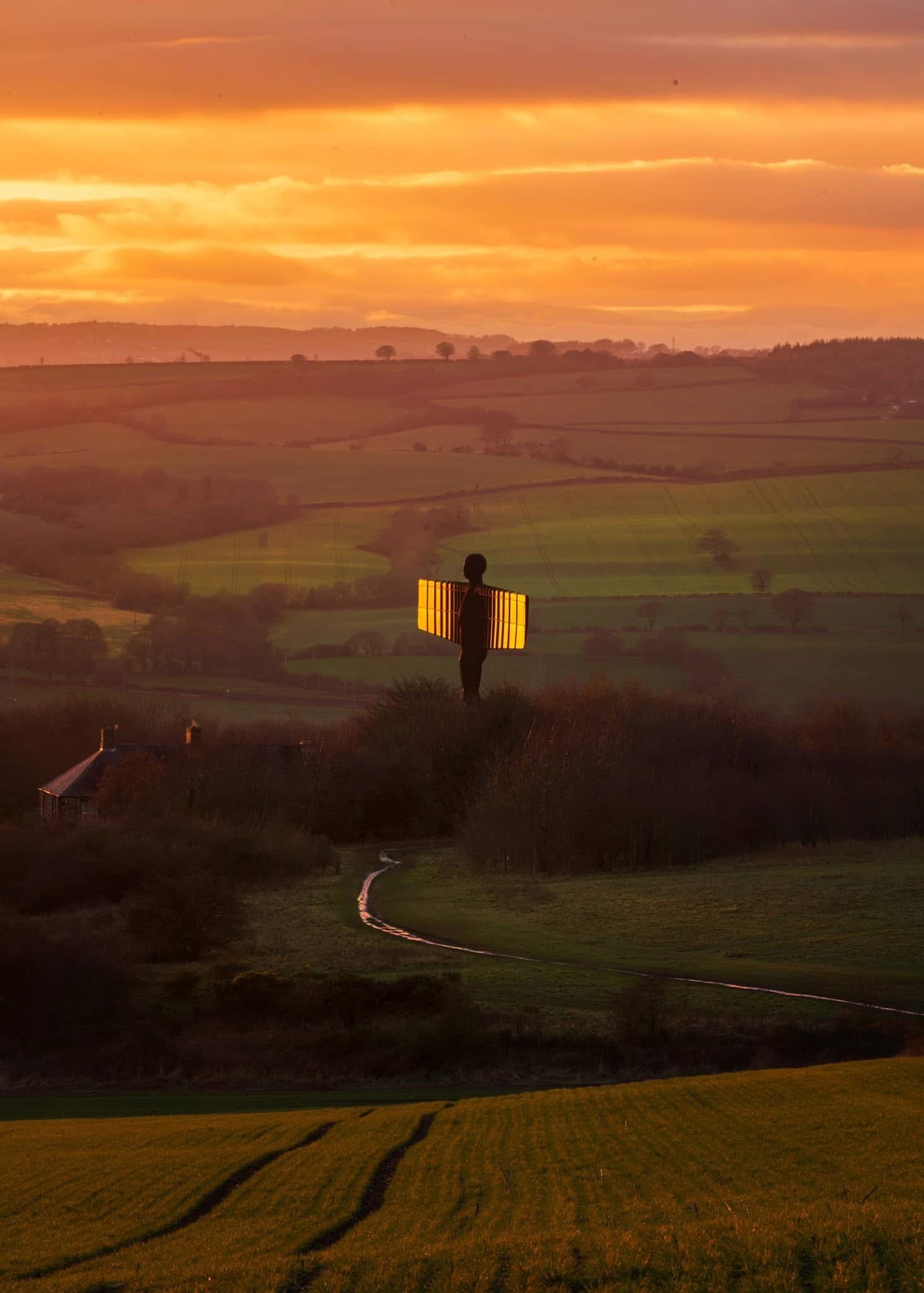 Golden sunset at the Angel of the North and surrounding countryside.