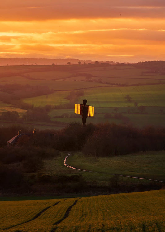Golden sunset at the Angel of the North and surrounding countryside.