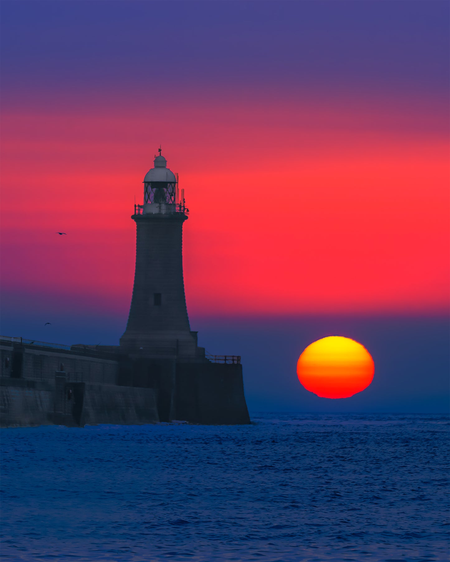 Beautiful muted sun by Tynemouth Lighthouse.