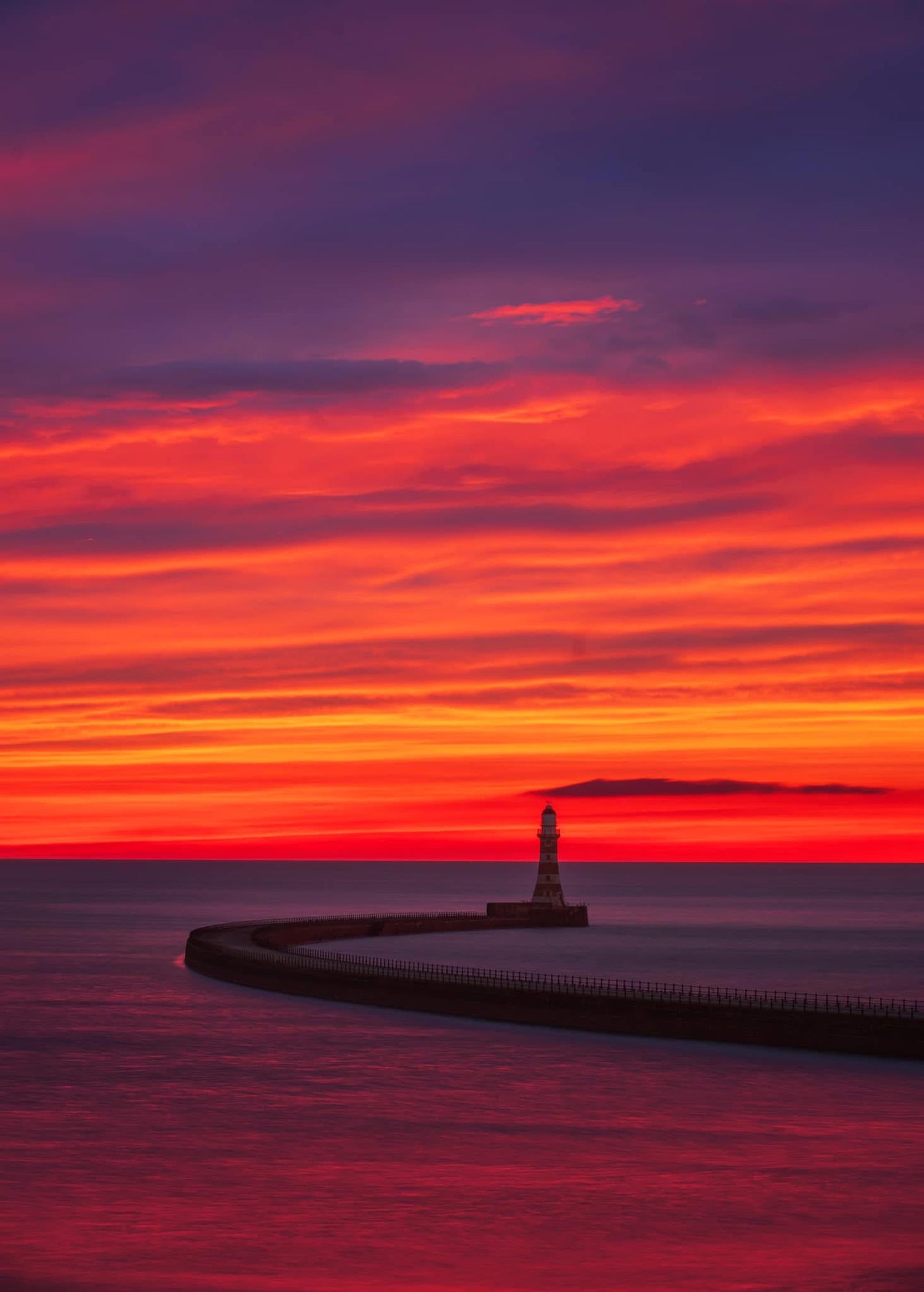 Beautiful orange sunrise sky at Roker.