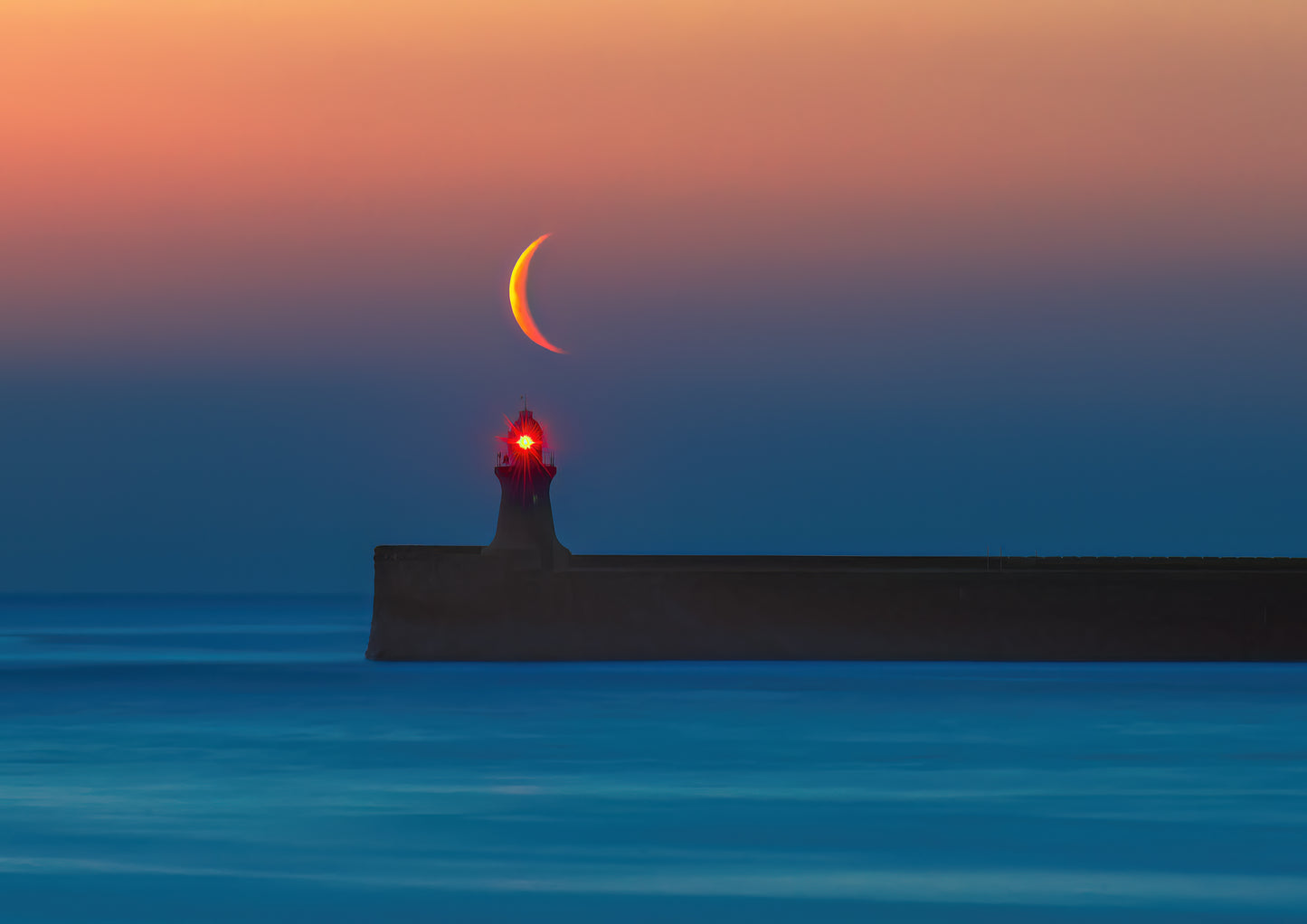 Beautiful Crescent moon right over south Shields Lighthouse.