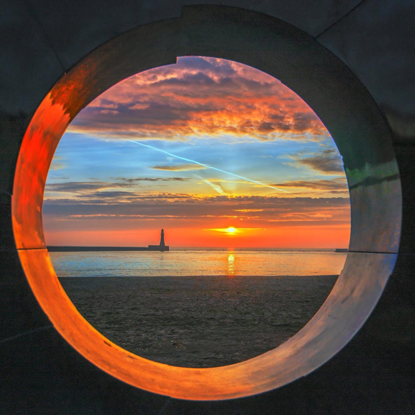 Sunrise through the Roker Porthole