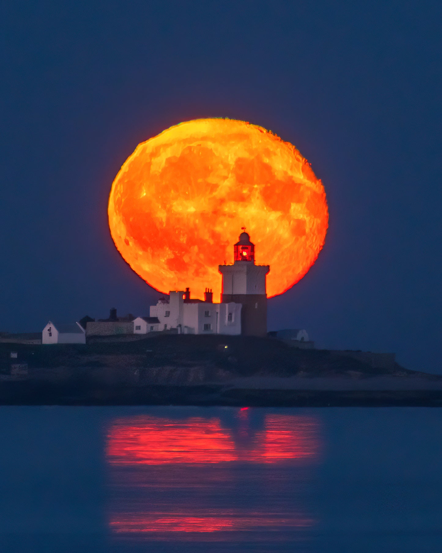 Beautiful moon over Coquet Lighthouse