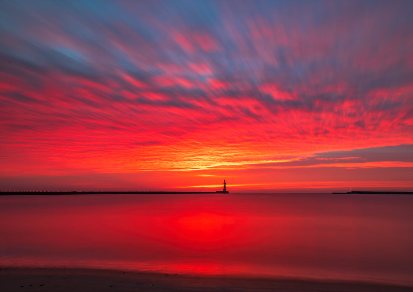 Long exposure of a gloriously colourful Roker sunrise.
