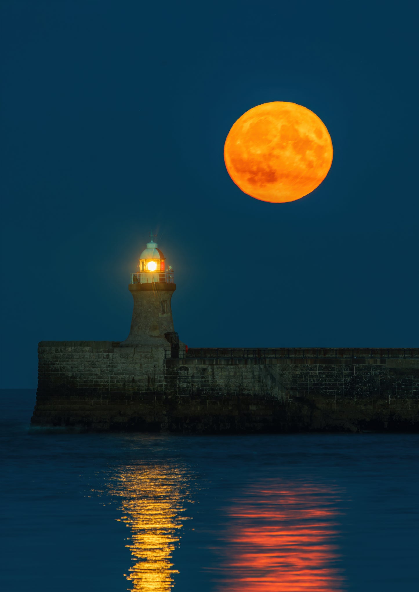 Full moon rising above South Shields Lighthouse.