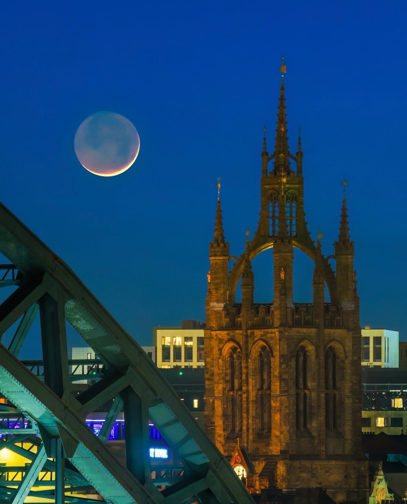 The new moon with the Tyne Bridge and St. Nicks Cathedral.