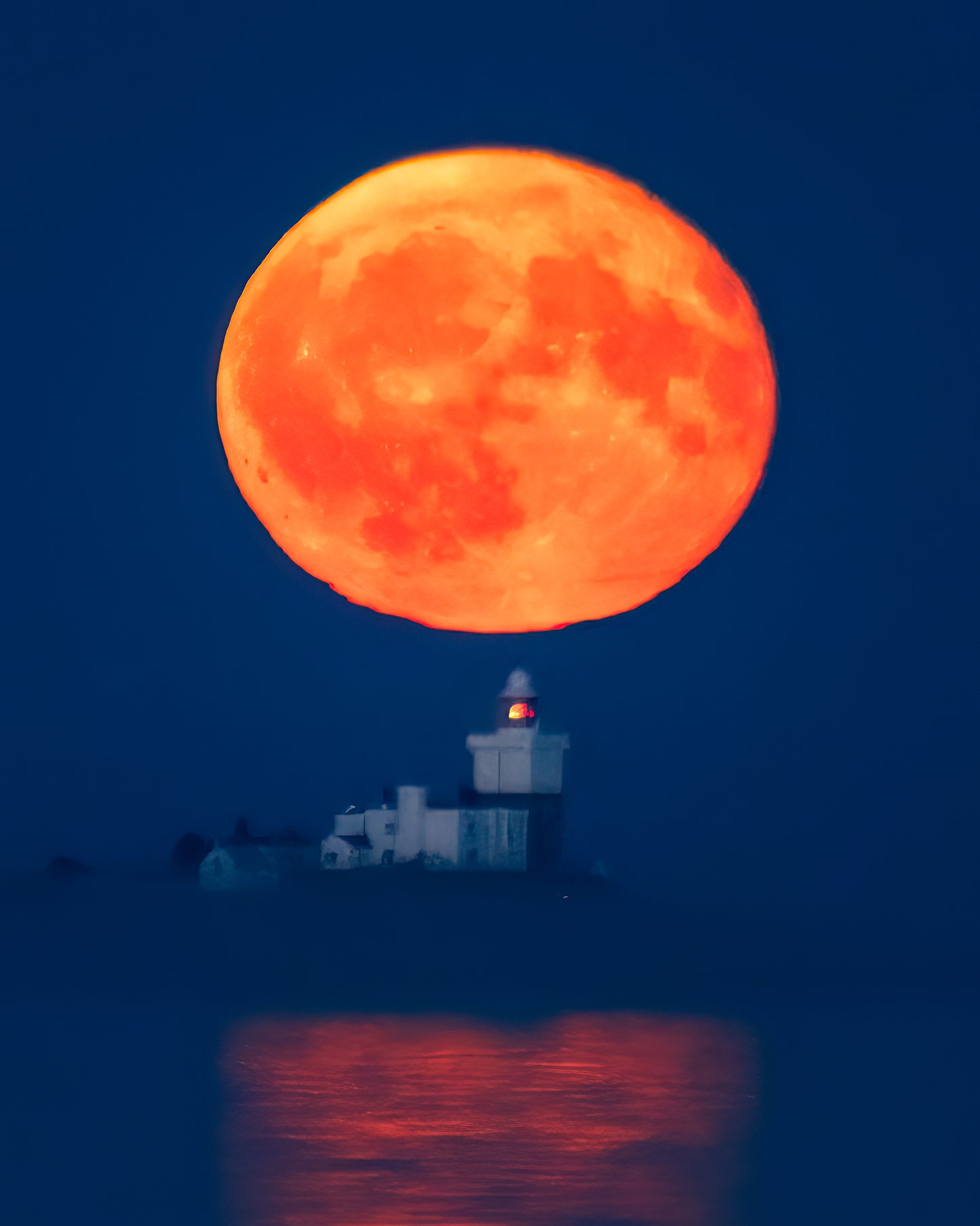 Massive moon over Coquet Island.