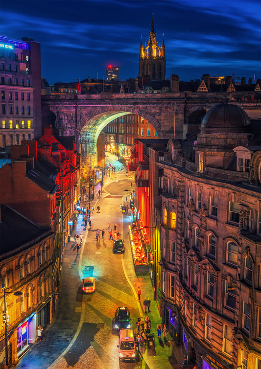 Colourful nighttime scene of Newcastle nightlife.