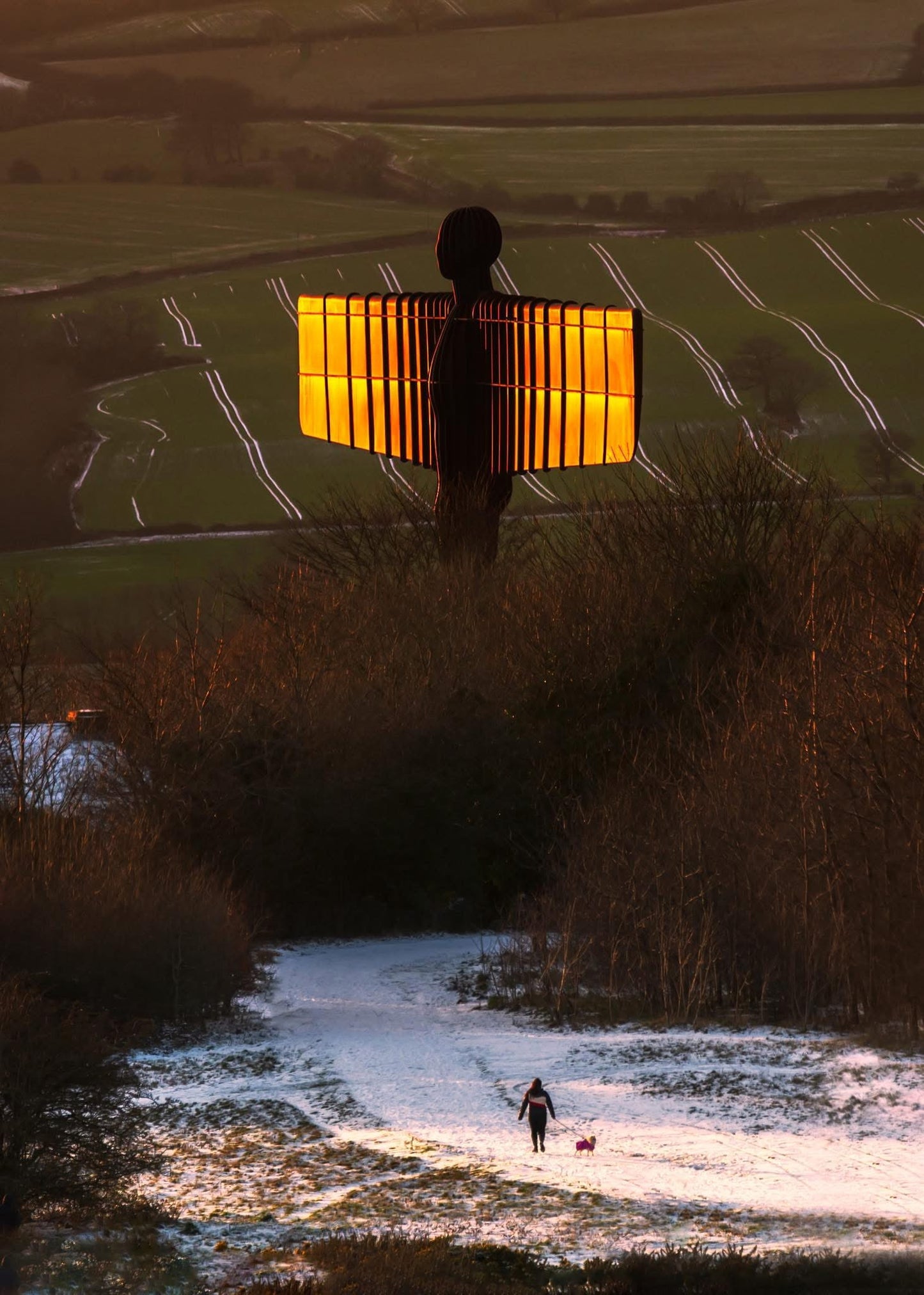 A snowy view of the Angel of the North