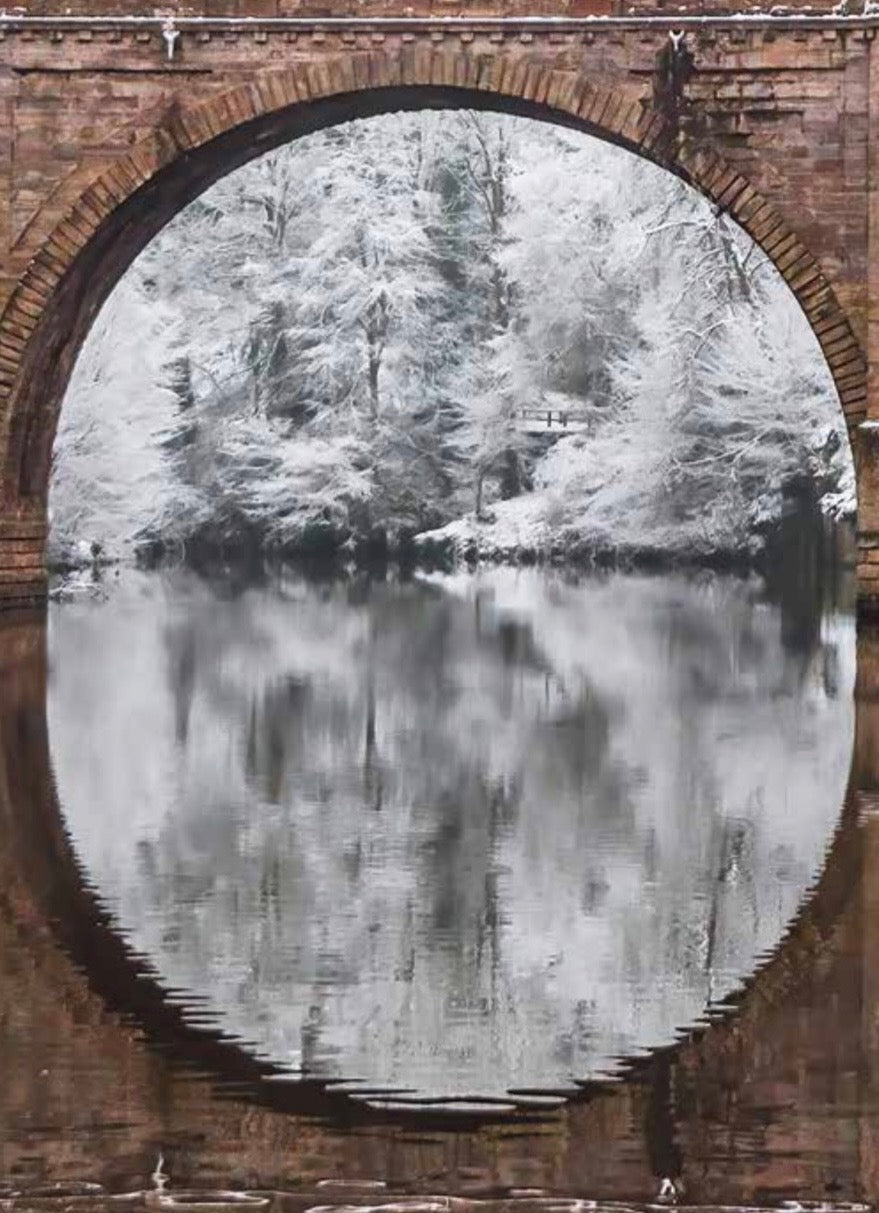 Snow scene through Prebends Bridge.