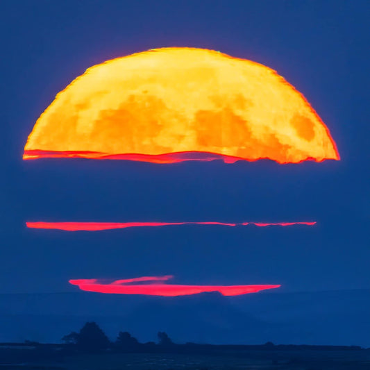 Rising full moon over Roseberry Topping.