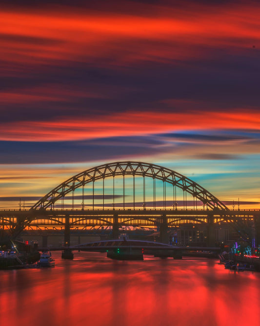 Tyne bridge from Millennium Bridge during a beautiful sunset.