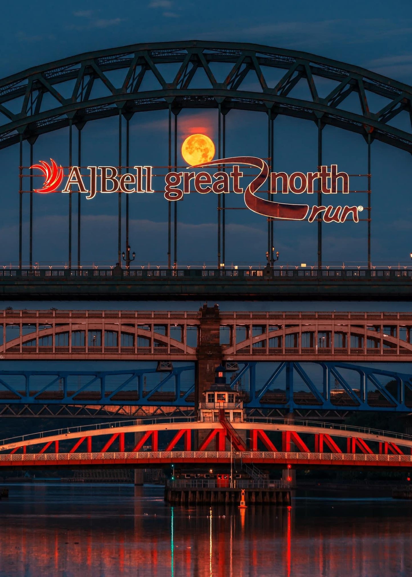 Full Sturgeon Moon nestled inside the Tyne Bridge.