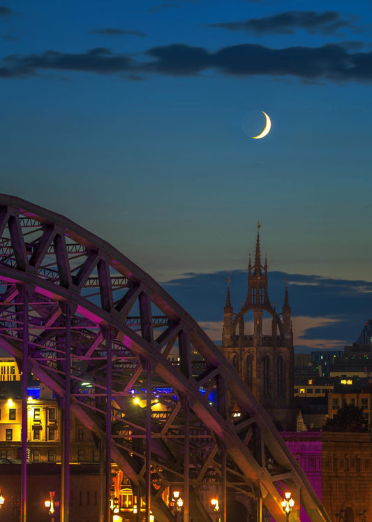 A crescent moon over Newcastle Cathedral.