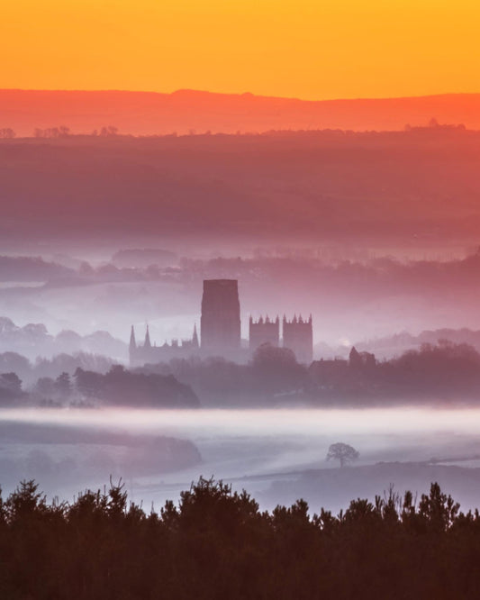 Durham cathedral surrounded by mist.