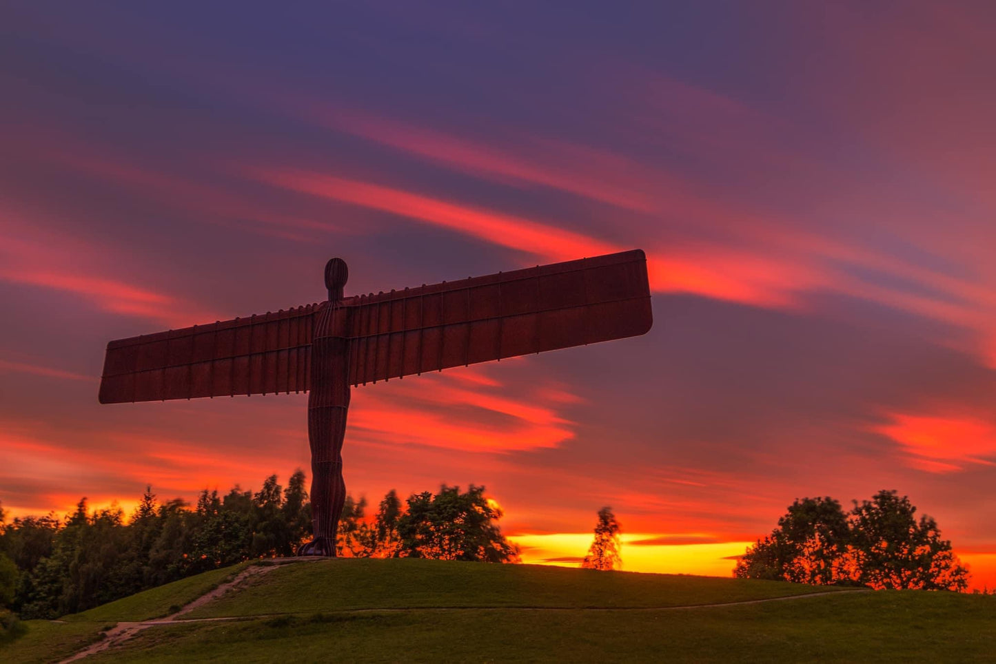 Angel of the North and a red streaky sky.