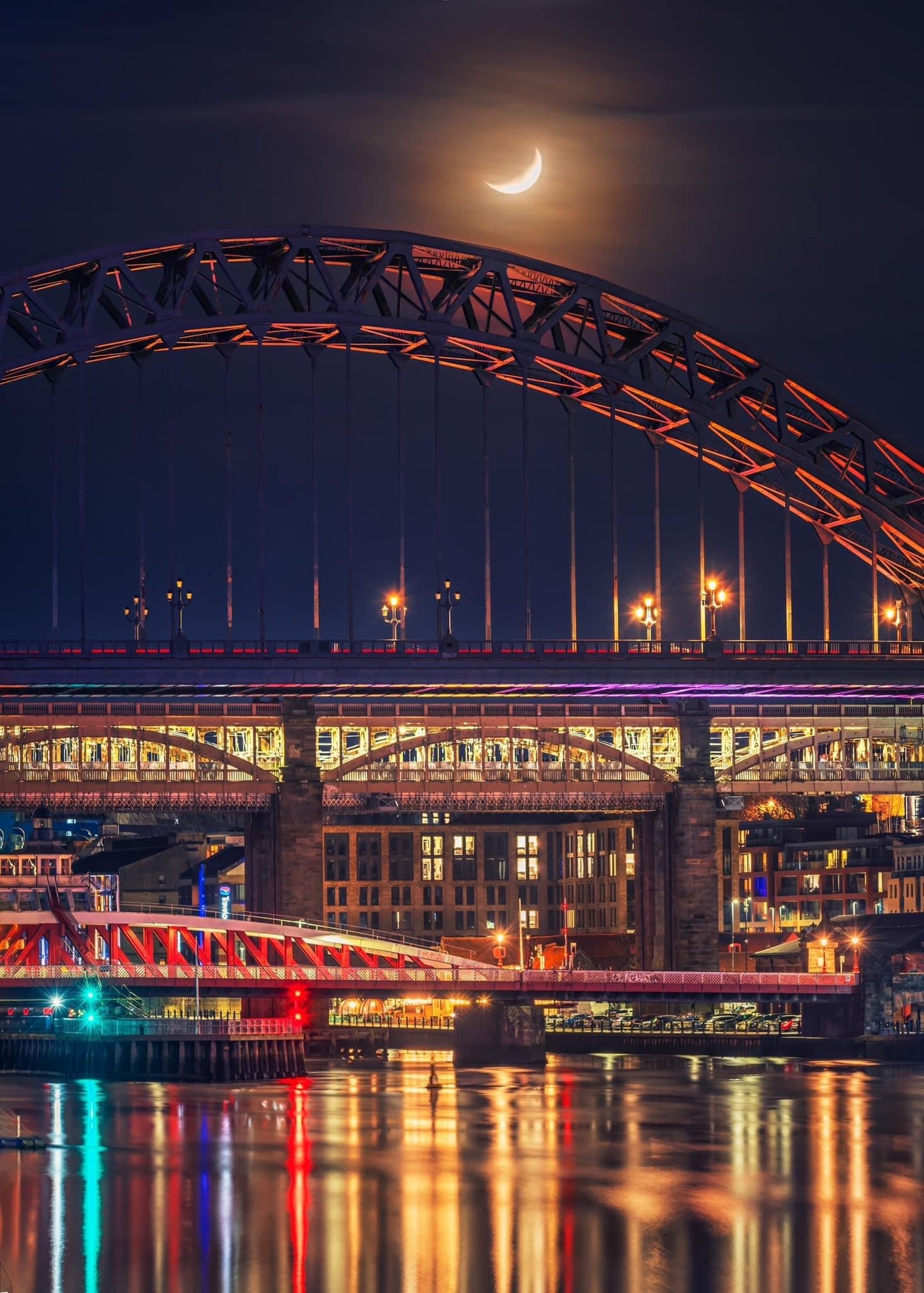 A crescent moon above the Tyne Bridge.