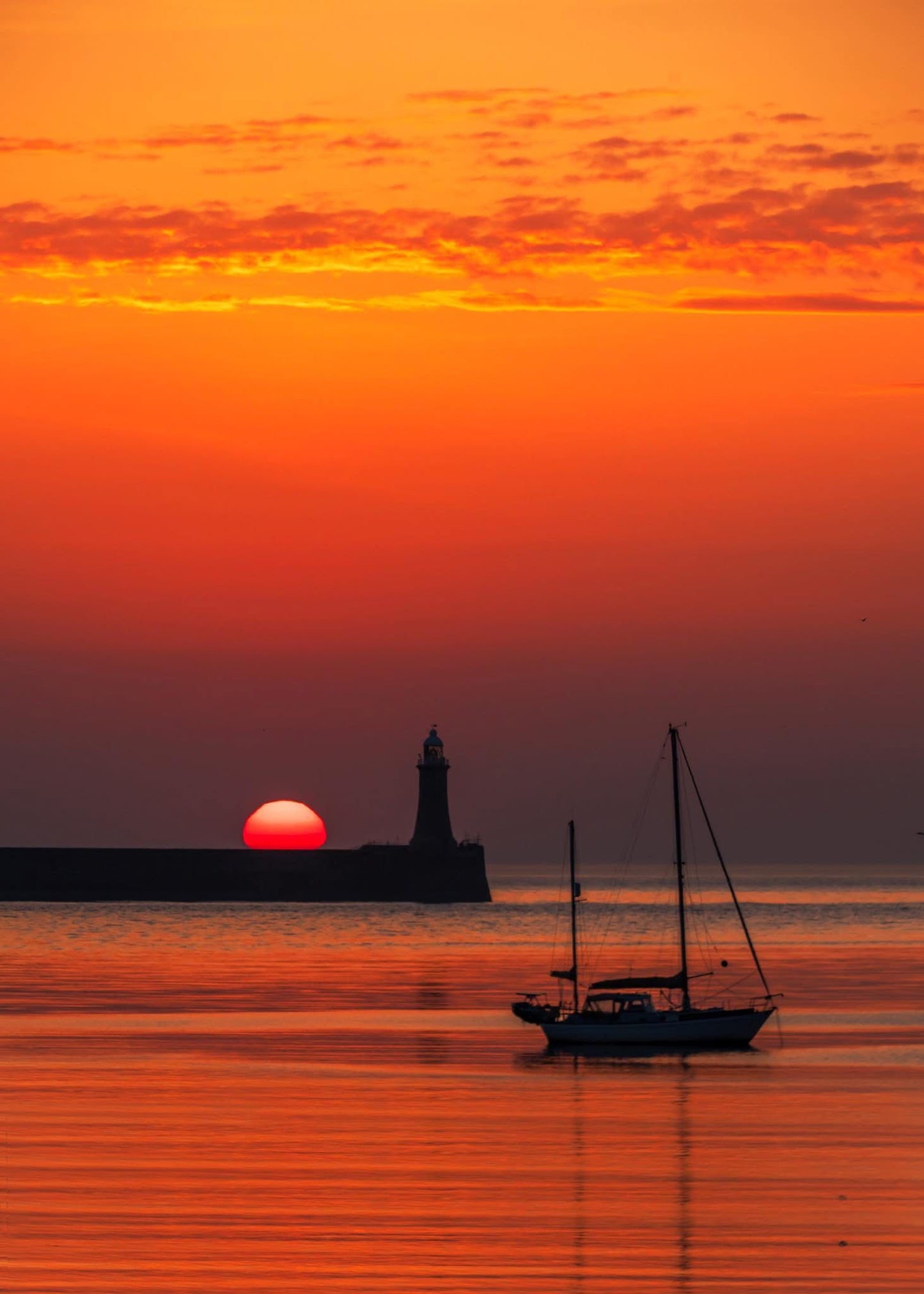 Golden summer solstice sunrise at South Shields.