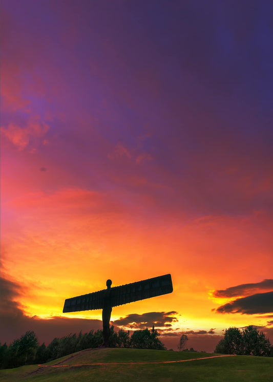 The Angel of the north under a glowing sky.