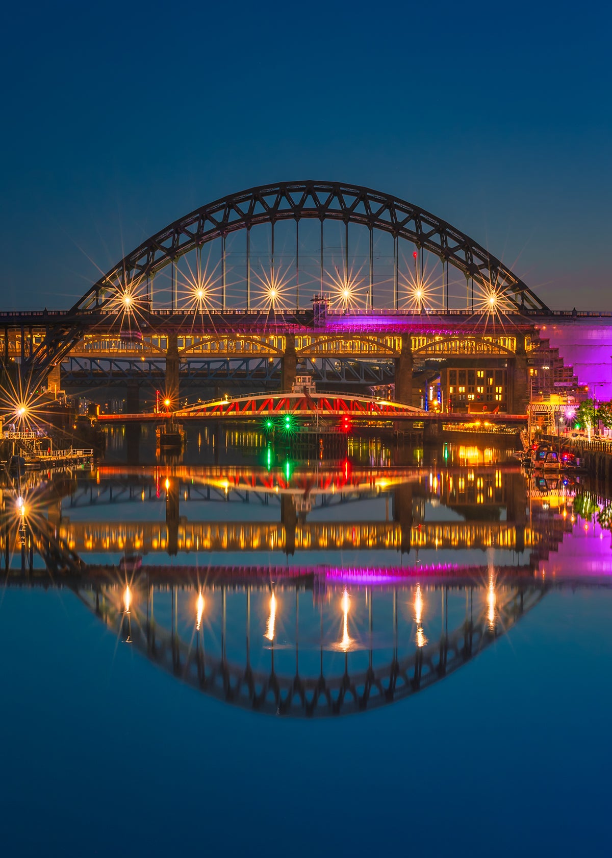 Calm and serene blue our reflections on the River Tyne.