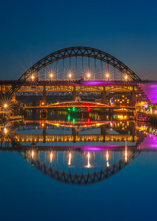 Calm and serene blue our reflections on the River Tyne.