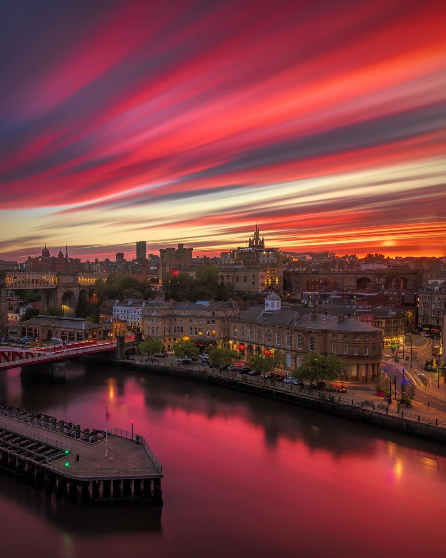 Long exposure of a beautiful red sky over Newcastle