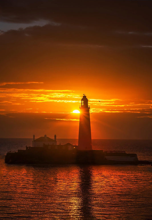 A golden sunrise by St. Mary’s Lighthouse.