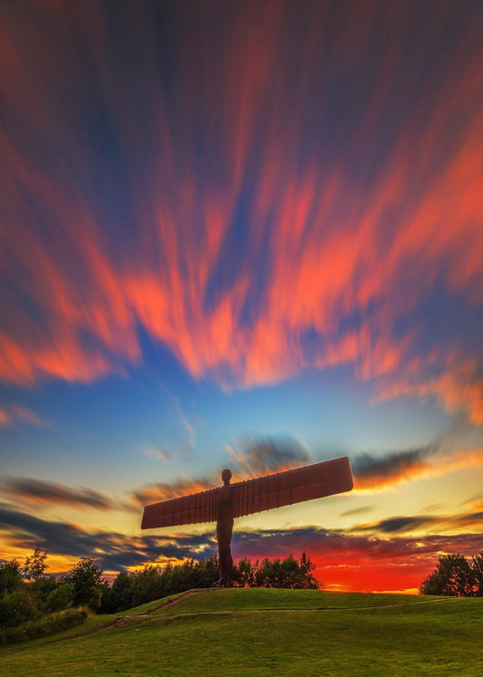 Long exposure of a colourful sunset sky at the Angel of the North.