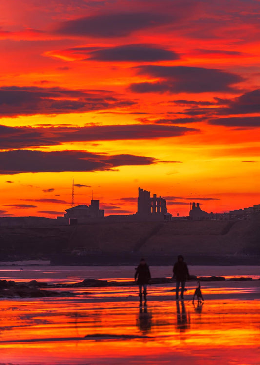 Stunning sunrise skies over Tynemouth Priory .