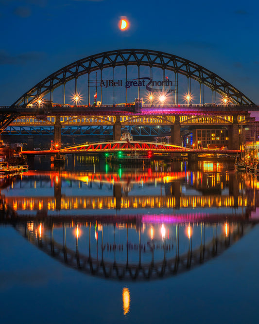 A half moon with The Tyne bridge.
