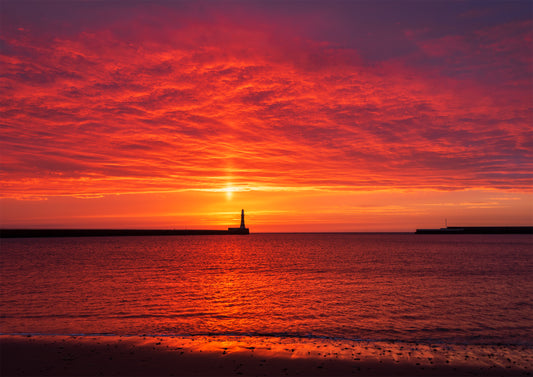 Beautiful orange sunrise sky at Roker.