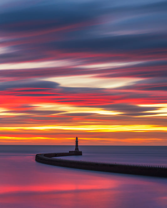 Roker Awash with sunrise colours.