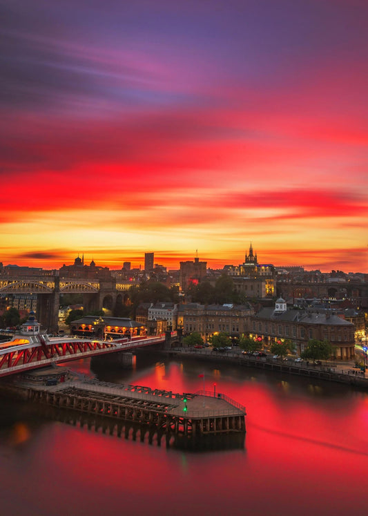 Long exposure of an amazing red sunset over Newcastle