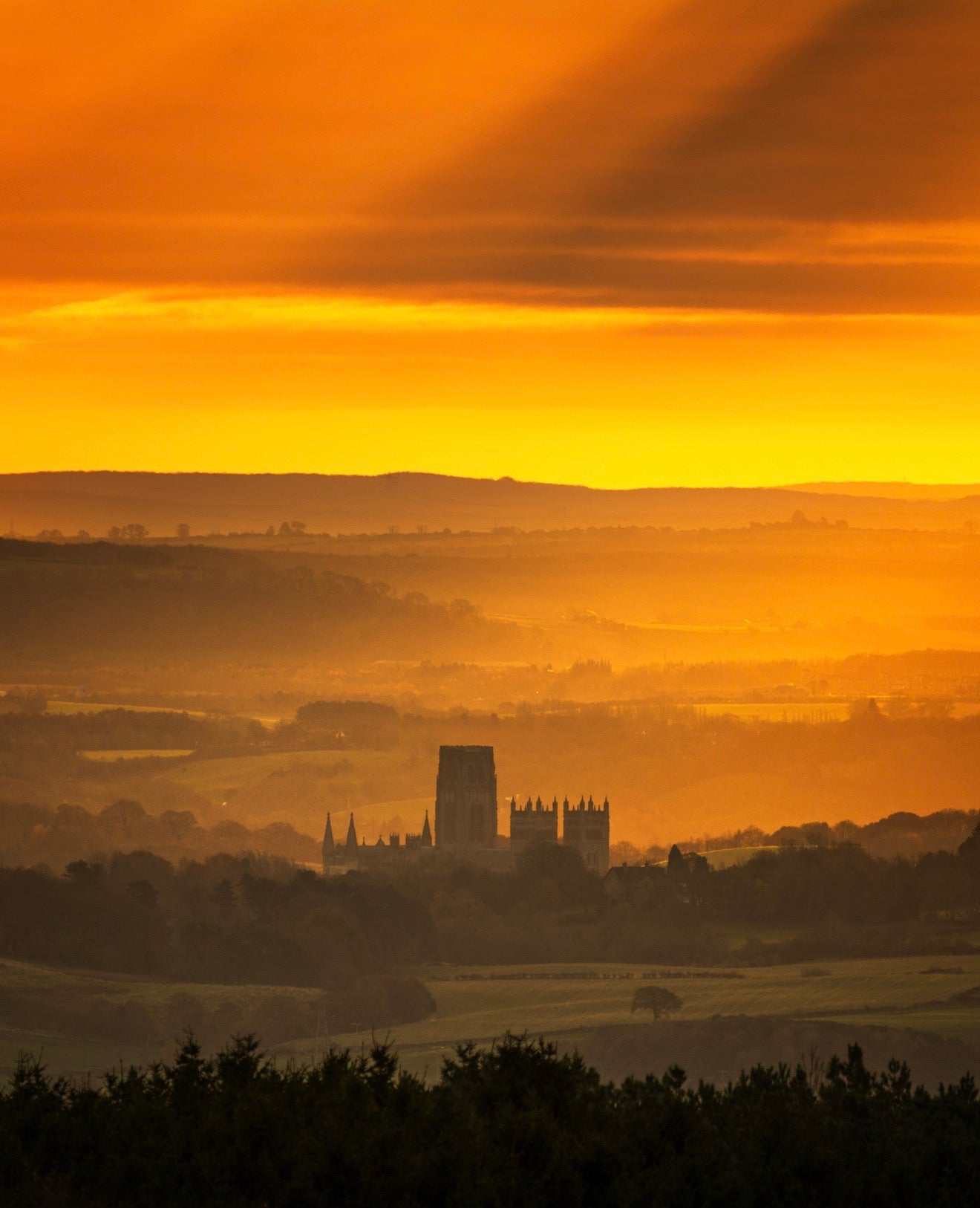 A beautiful golden sunrise over Durham Cathedral.