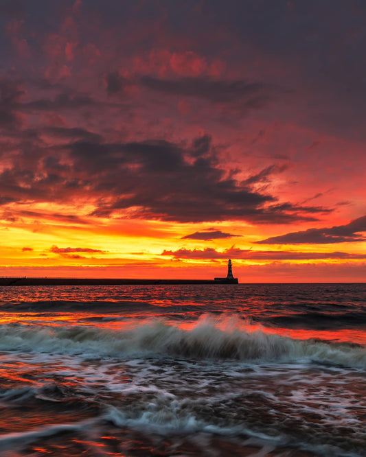 Beautiful Roker sunrise with choppy waves.