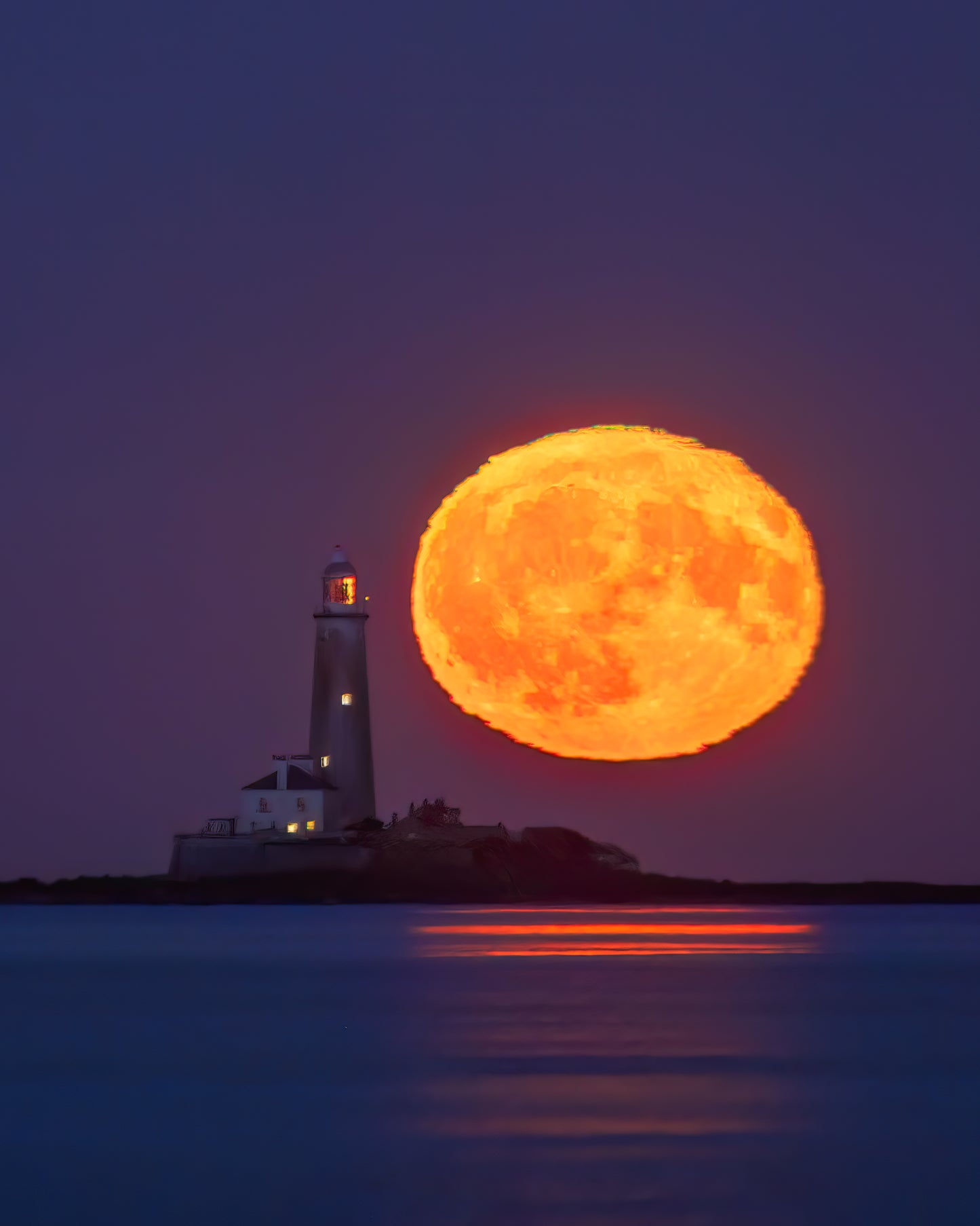 The moon and St.Mary’s lighthouse side by side.