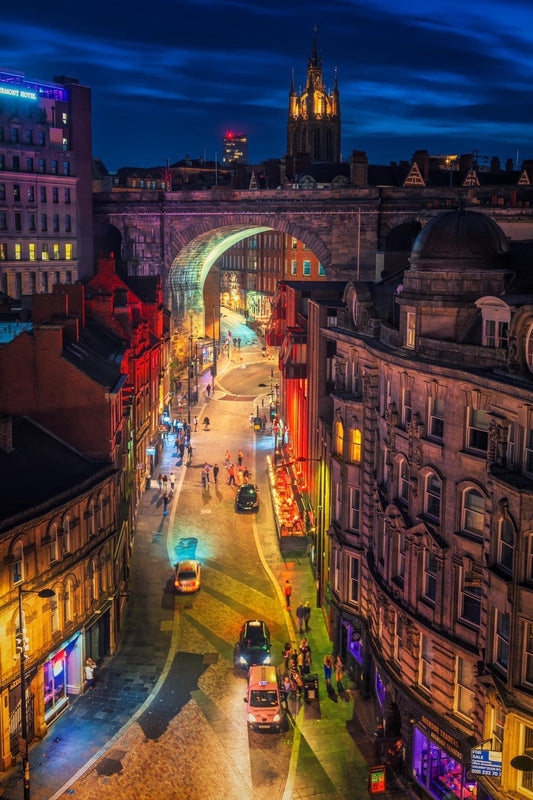 Colourful nighttime scene of Newcastle nightlife.