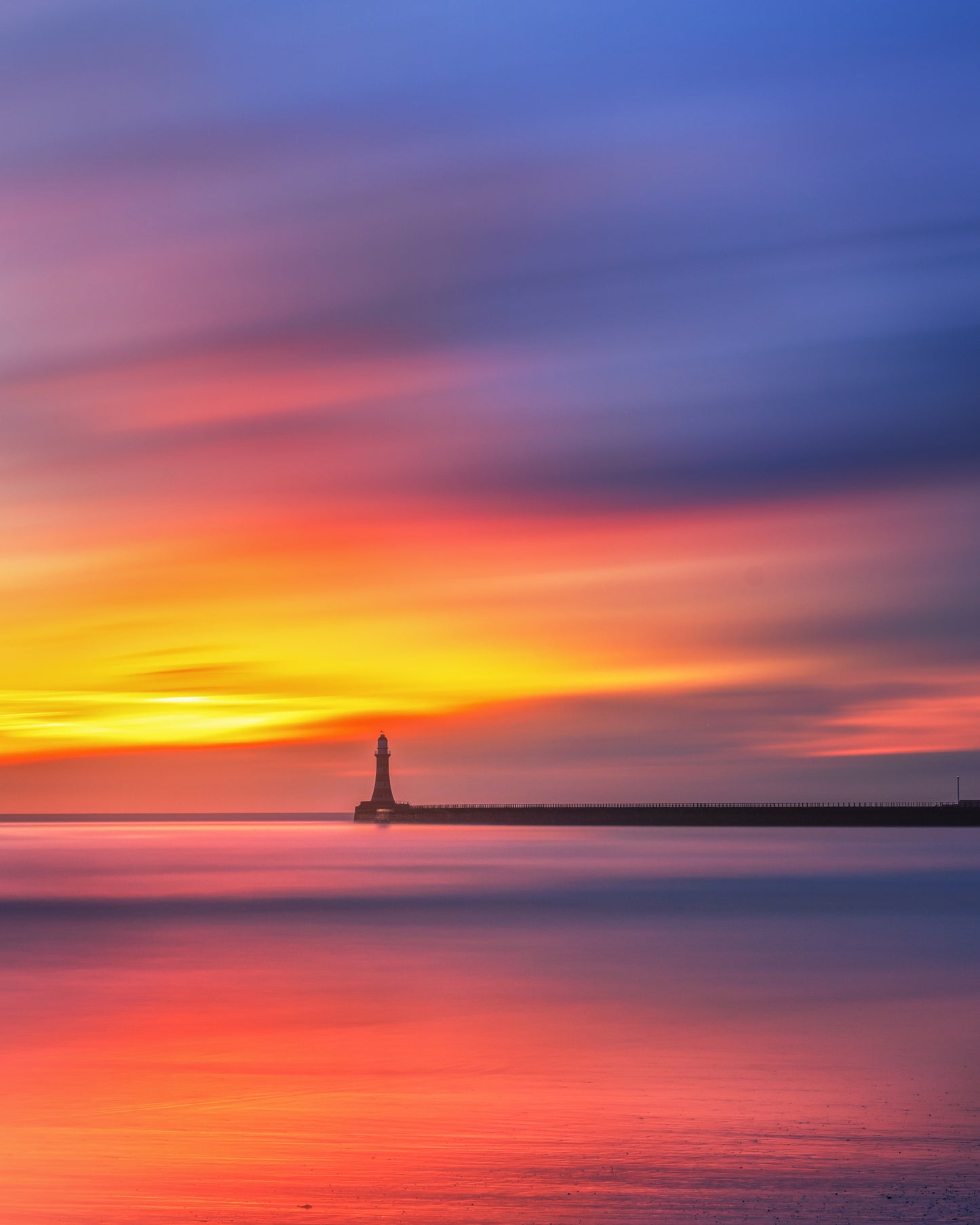 Long exposure of a colourful sky at Roker.