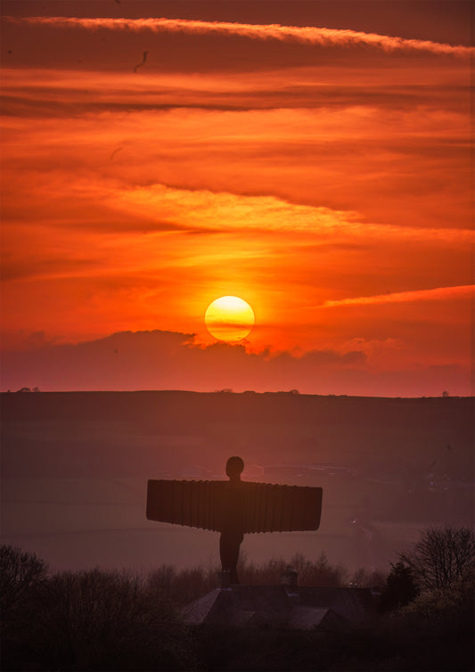 A hazy muted sunset over the Angel of the North.