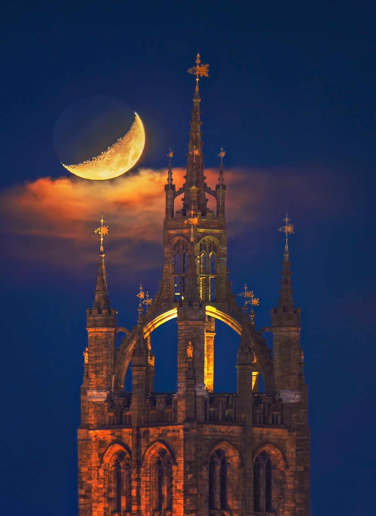 Newcastle Cathedral with a crescent moon.