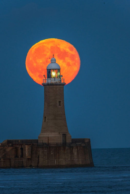 The full moon nestled on Tynemouth Lighthouse.