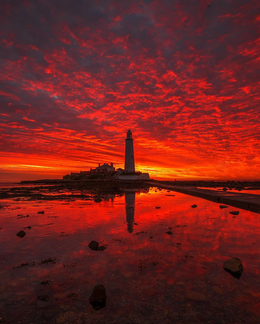 Amazing red sunrise at St. Mary’s lighthouse.