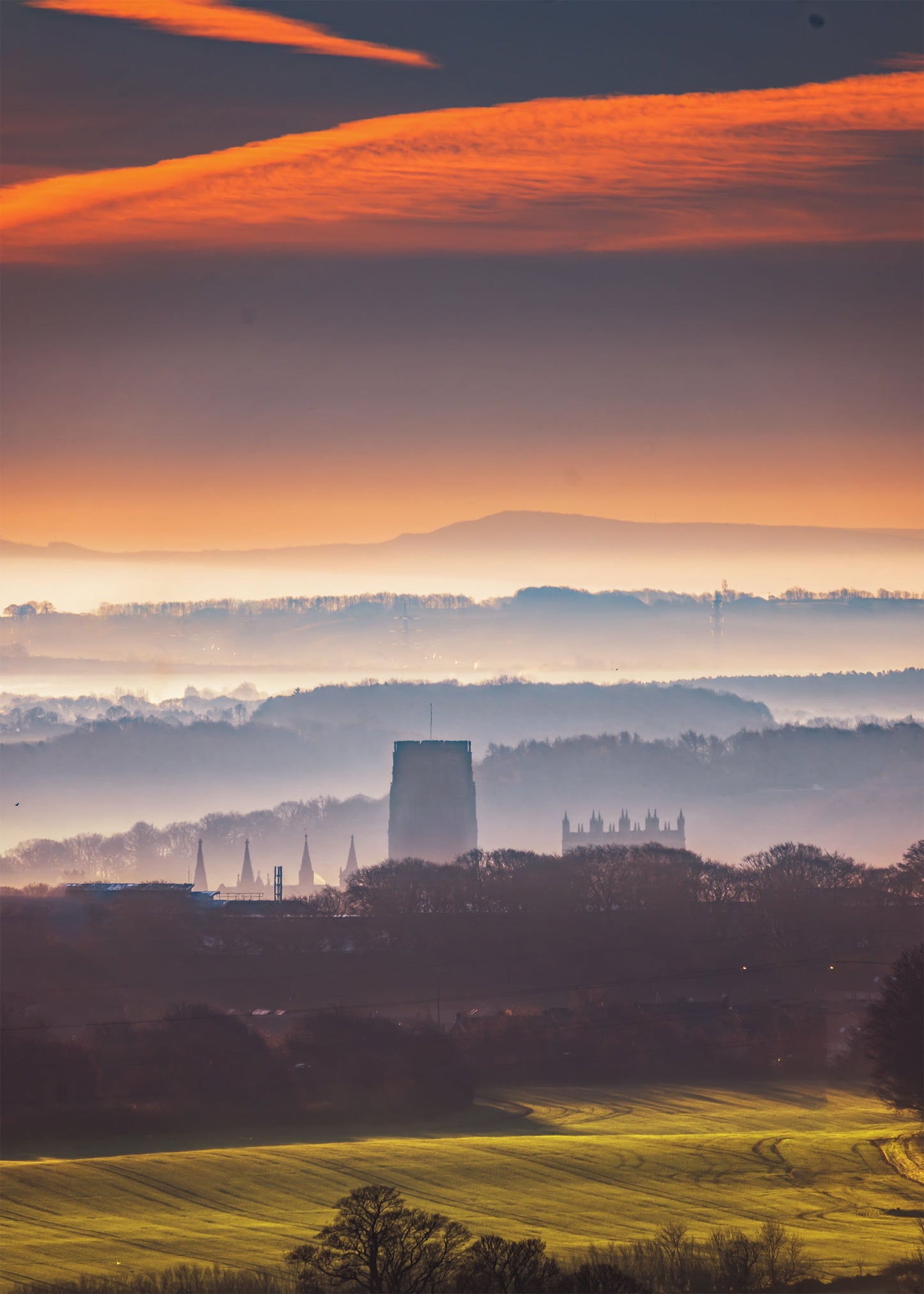 A distant view of a misty Durham Cathedral