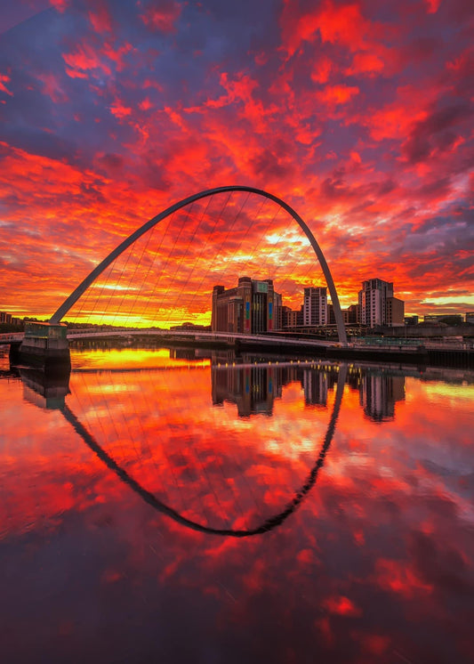 Stunning sunrise sky over Millennium Bridge.