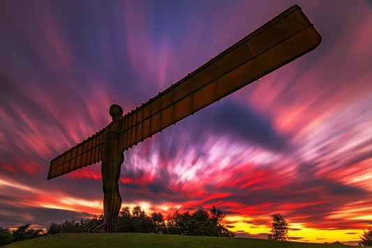 Long exposure of a colourful sunset sky at the Angel of the North.