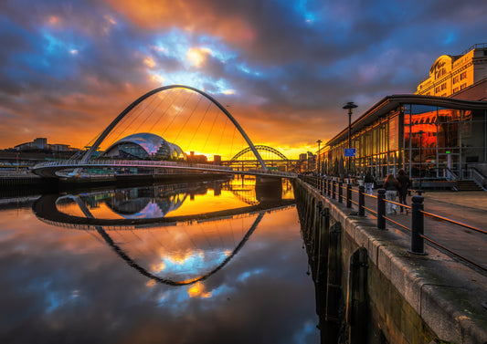 Golden sunset through Millennium Bridge.